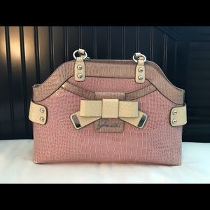 Beautiful pink purse by Guess